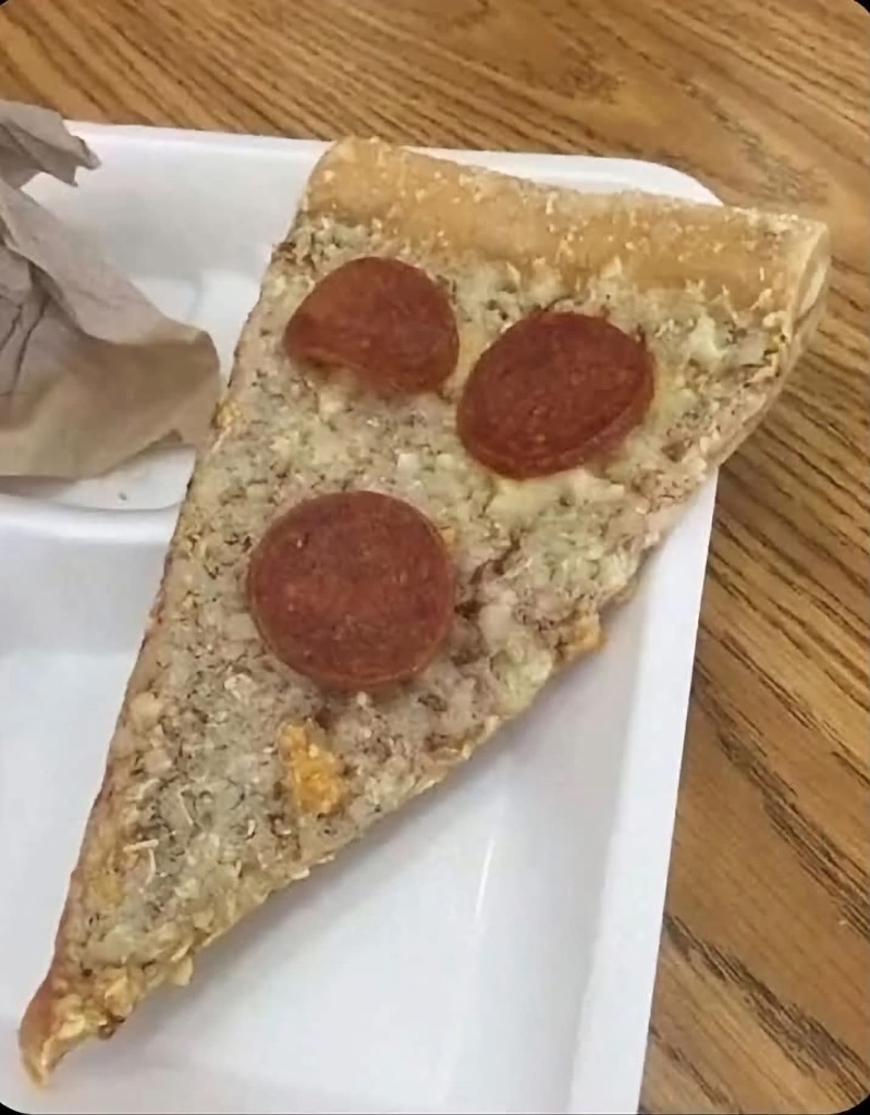 One slice of pepperoni pizza on a foam plate.